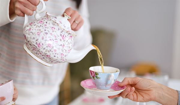 a cup of tea being poured