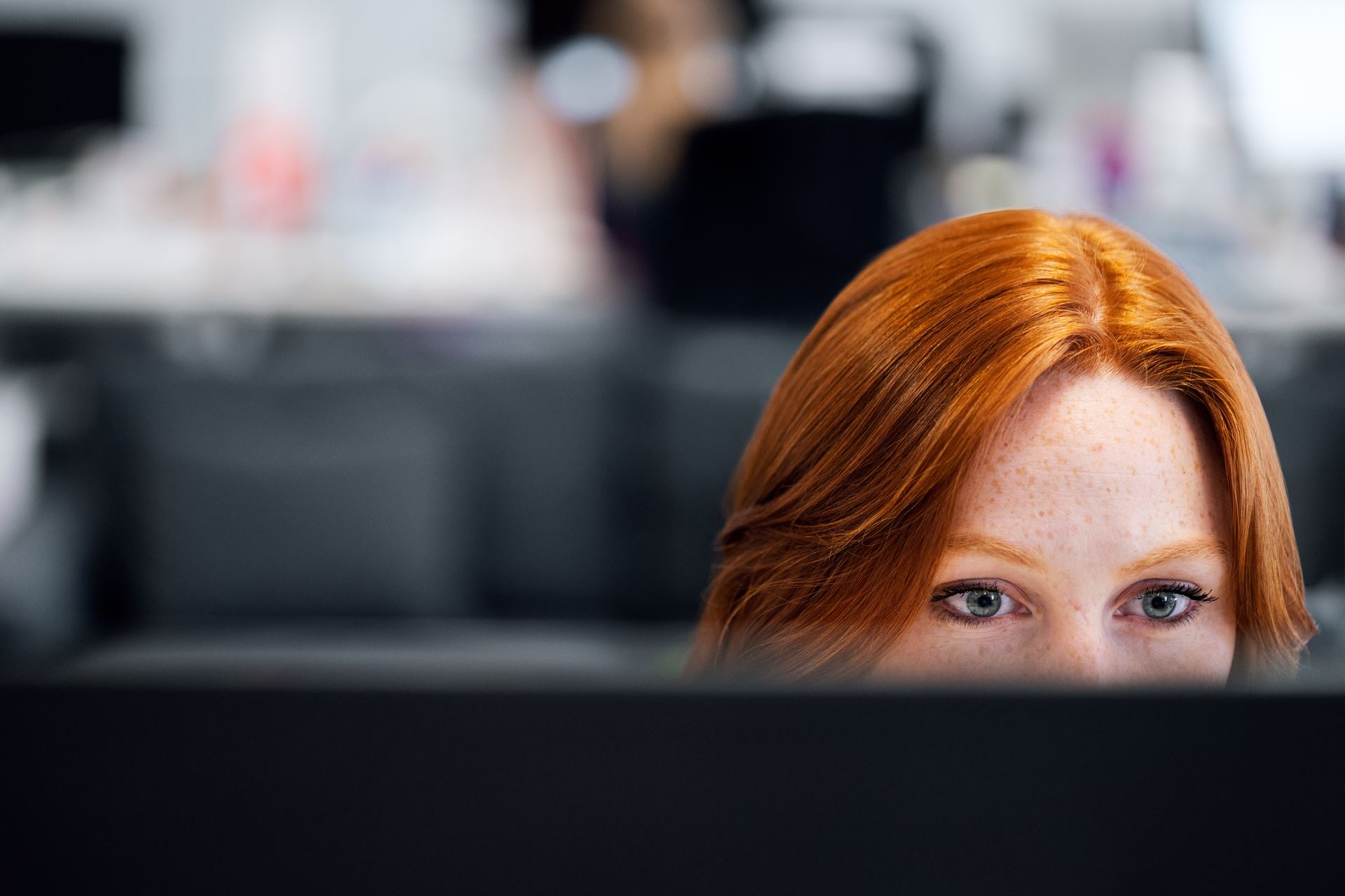 a woman looking at a computer screen