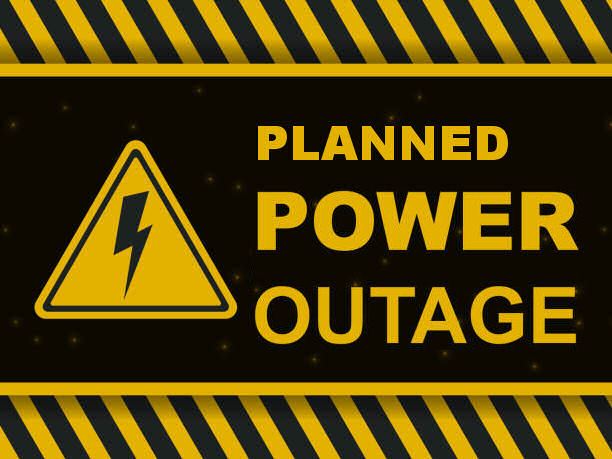 A yellow and black warning sign that reads "PLANNED POWER OUTAGE" next to a high-voltage lightning bolt symbol.